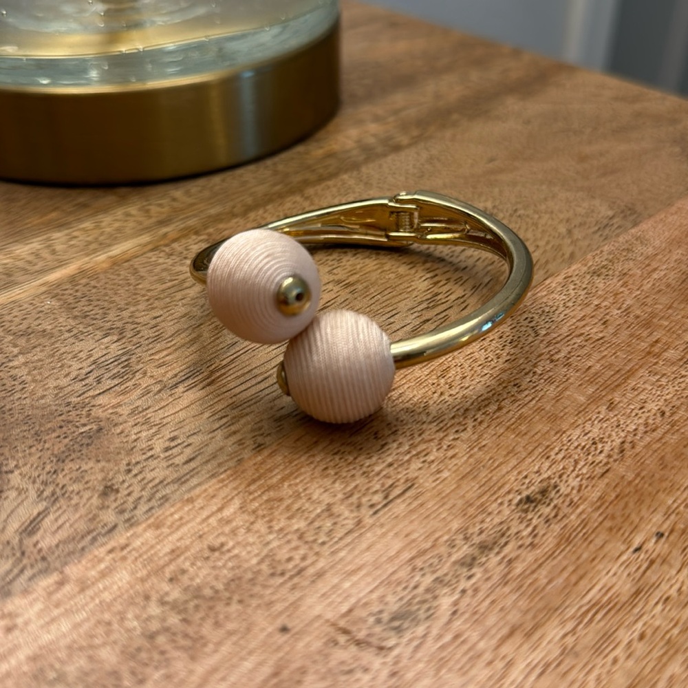 Pink rope and gold bracelet